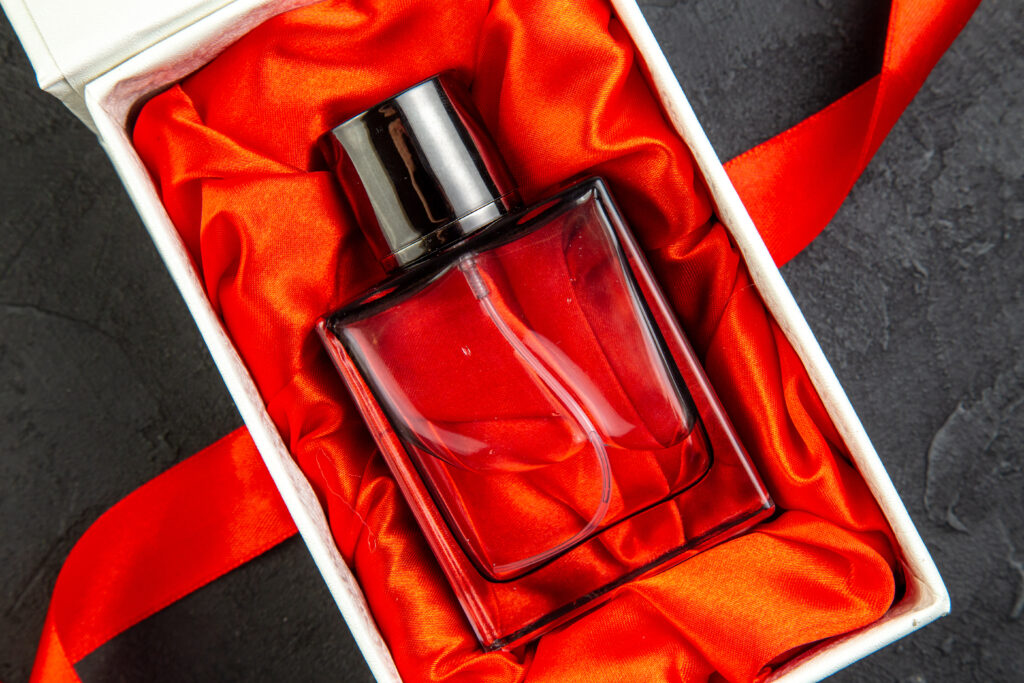 top-view-expensive-perfume-elegant-package-as-present-dark-table